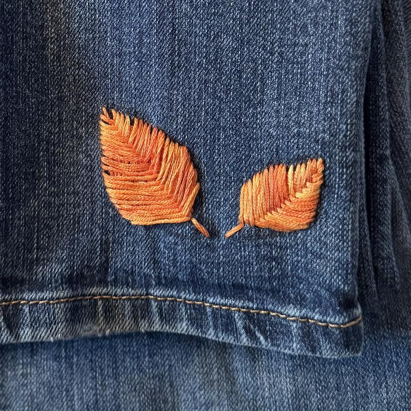 Embroidered leaves on denim patch