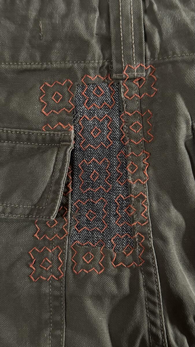 Sashiko olive jacket with geometric patch stitches